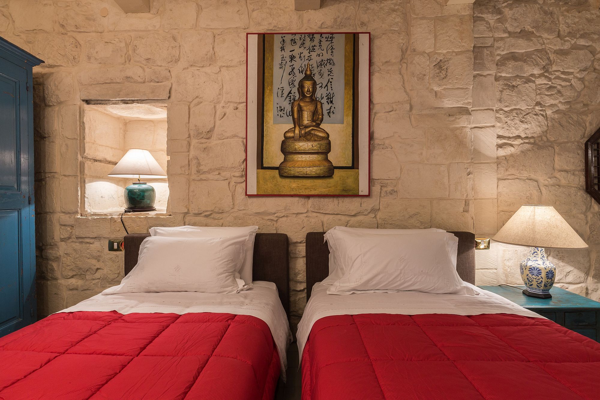 Decorative pieces from Far East lend tranquil charm to the interior in stone walls