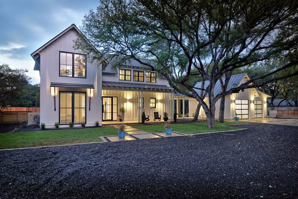 Modern farmhouse with a contrasting dark driveway