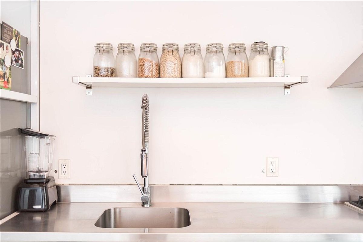 Open kitchen shelf with mason jars
