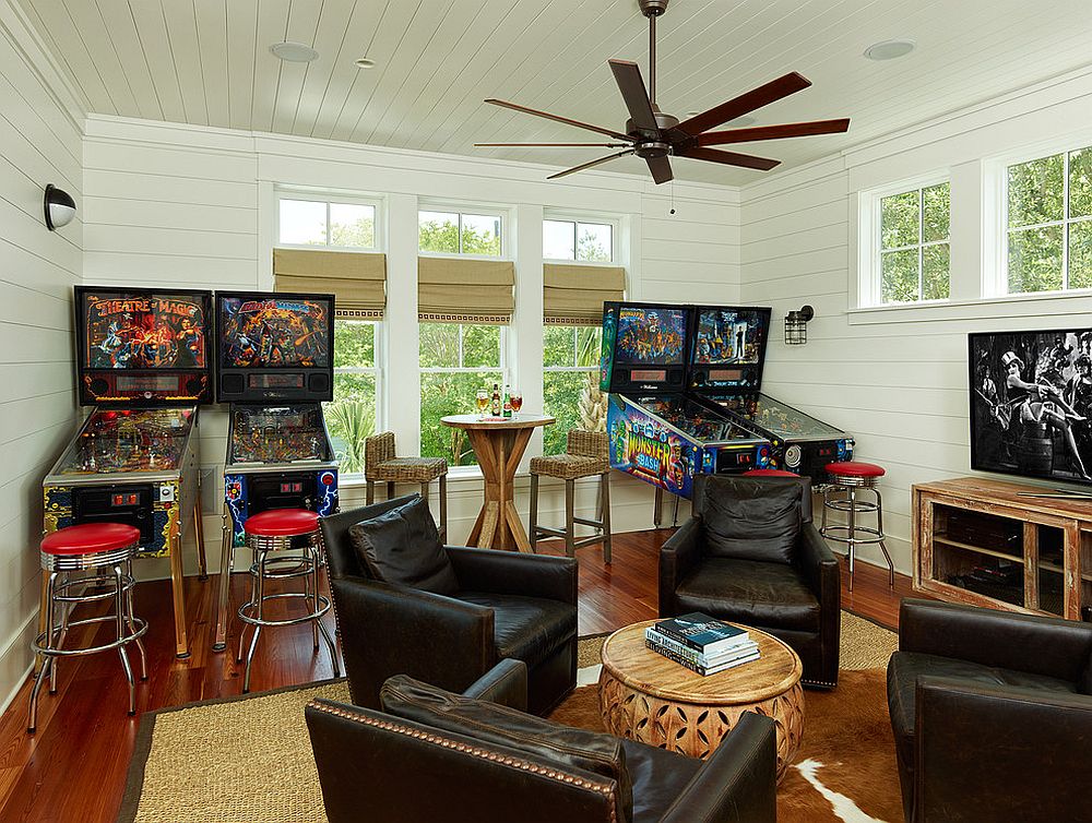 Tropical family room with a collection of pinball machines
