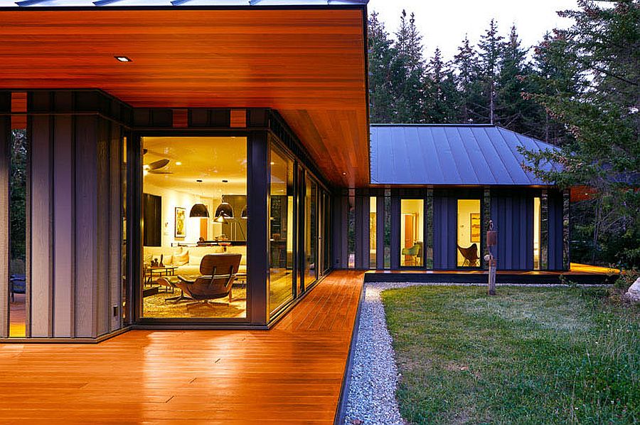 Corner windows of the Vermont retreat give a glimpse of the polished interior