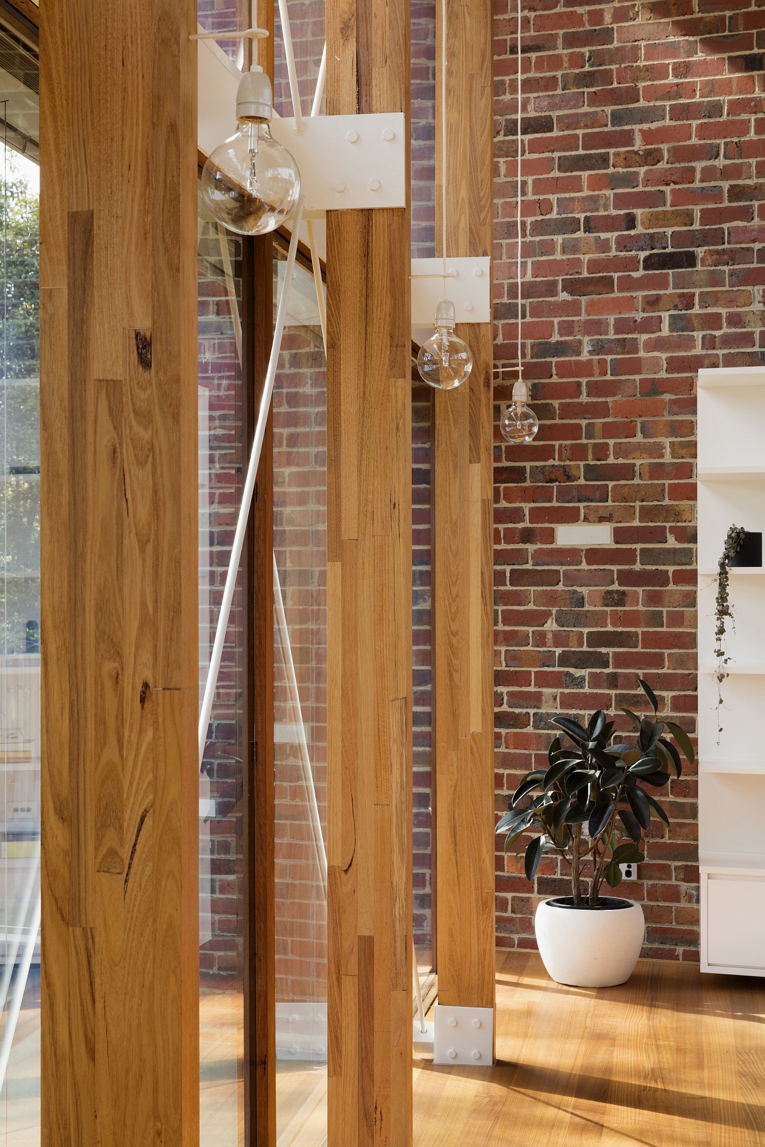 Wooden beams delineate the interior from the pavilion style outdoors