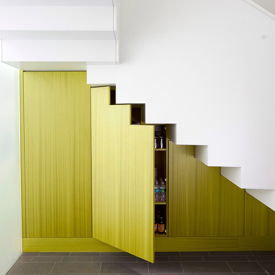 Brilliant little storage space underneath the white staircase
