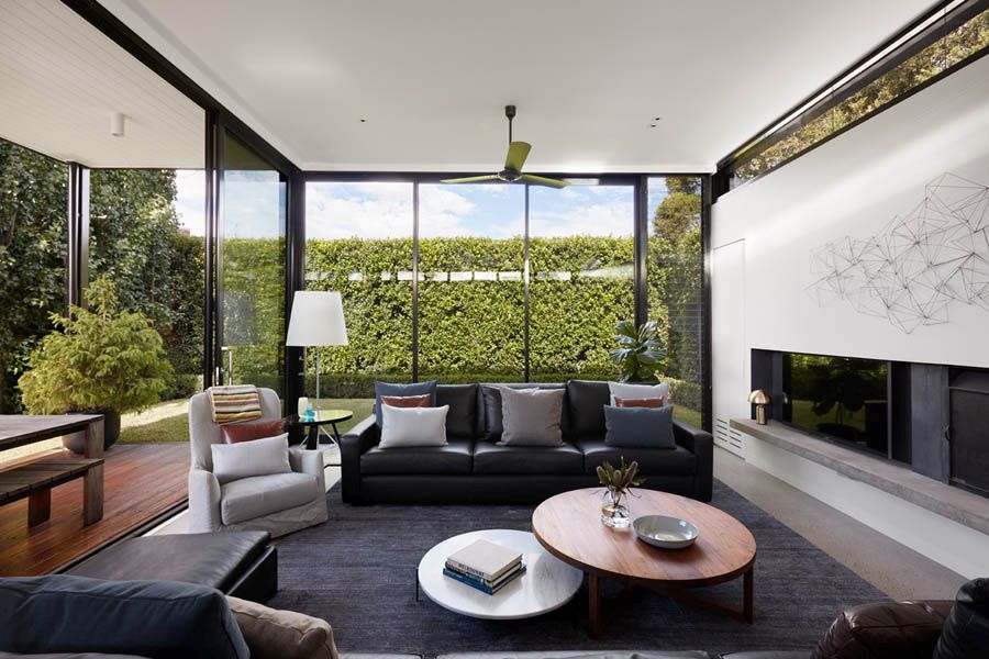 New living area with glass walls and sliding glass doors completly opens up to the rear garden
