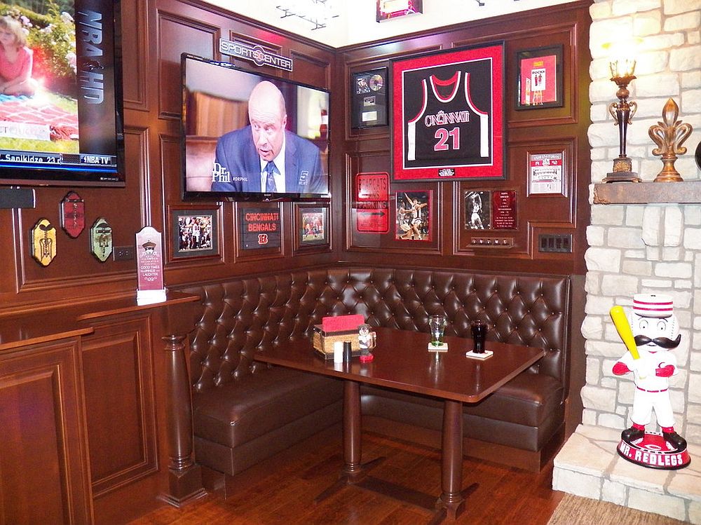 Small nook in the living room turned into a media room with sports theme
