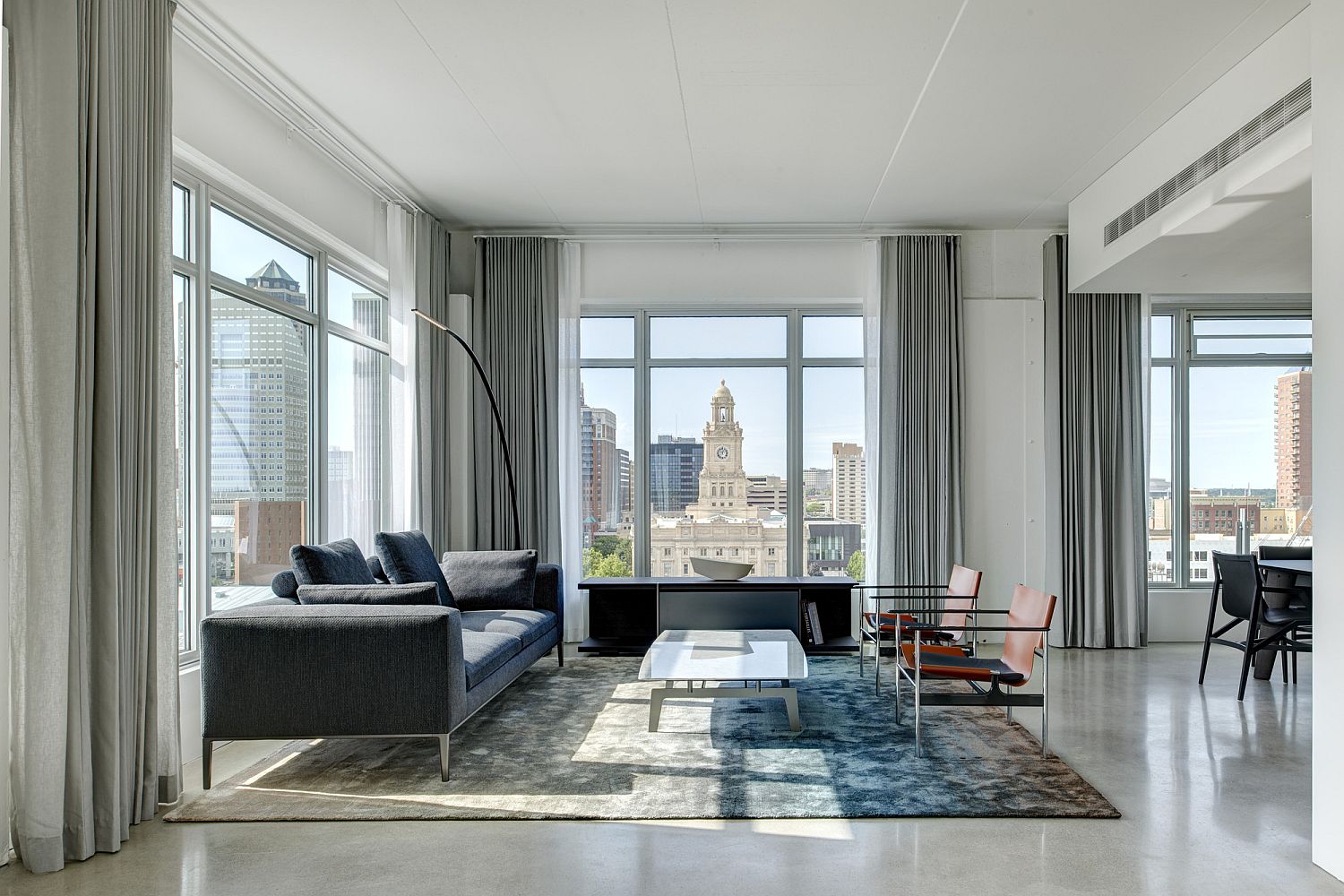 Large windows bring natural light into converted warehouse apartment