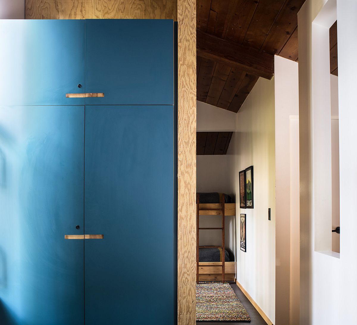 Blue closet doors give the bedrooms a more organized and polsihed look