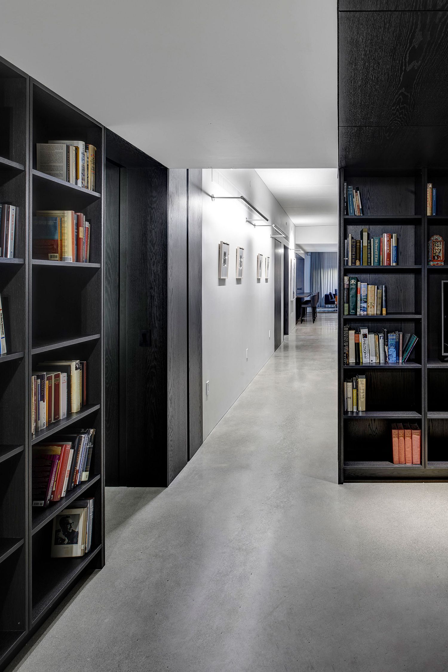 Bookshelves crafted using dark wooden elements make a big impact