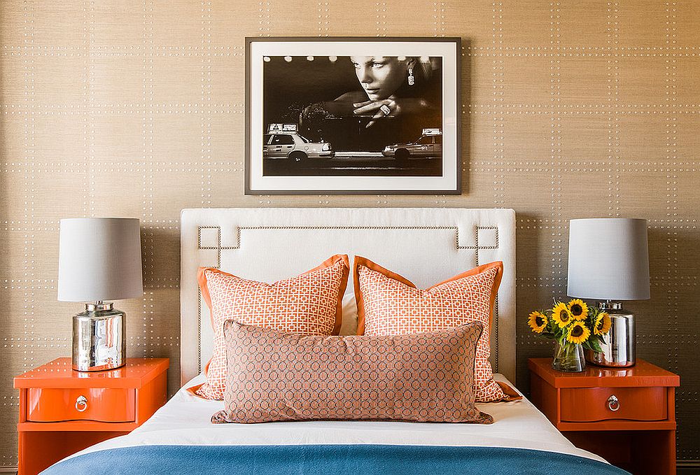 Contemporary bedroom with a dashing accent wall with orange nightstands