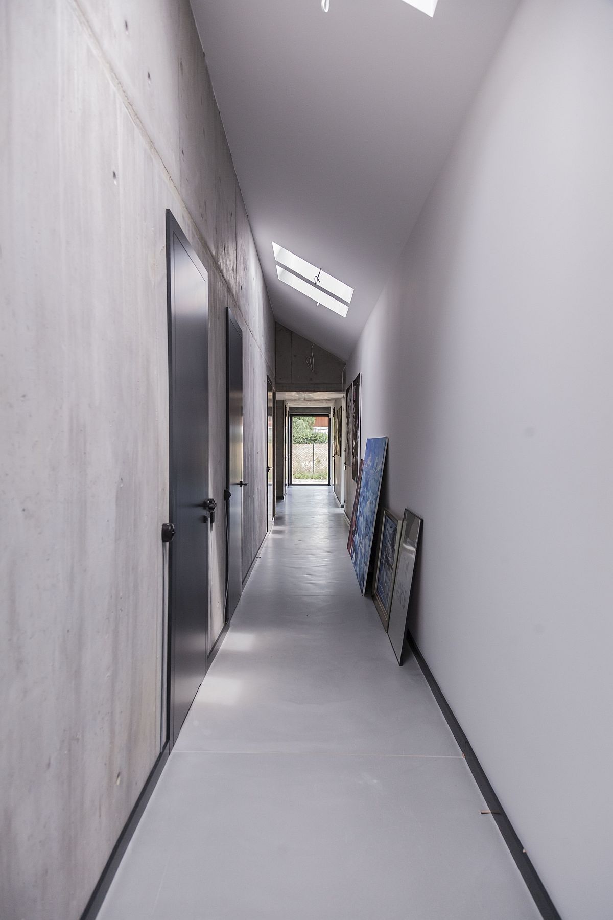 Large corrridor inside the house also acts as a lovely display zone for wall art