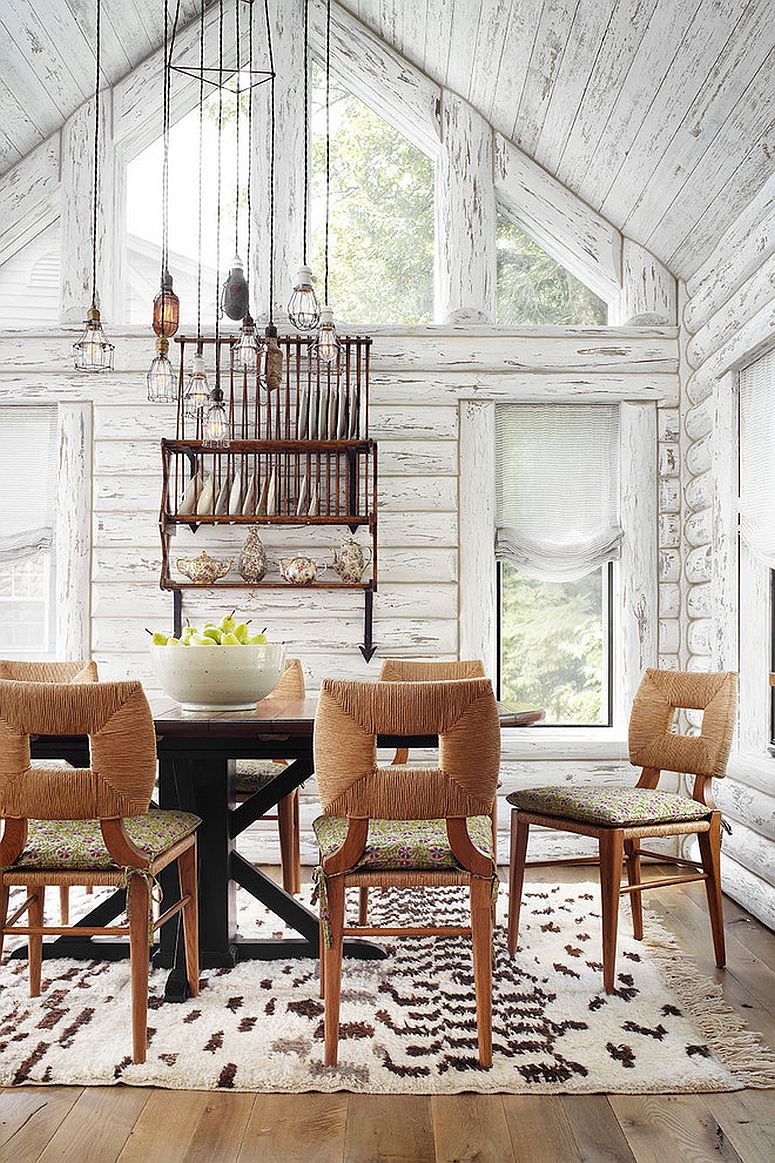 Spacious, double height dining room with rustic style and a plate rack