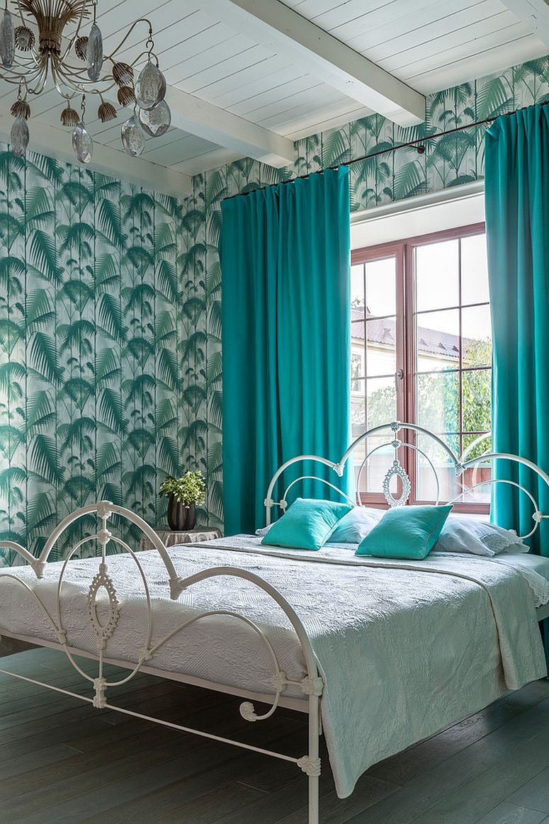 Lovely use of green and teal in the vivacious tropical style bedroom