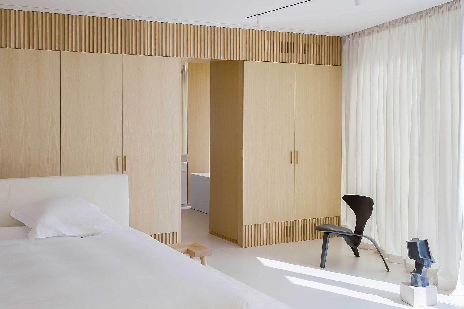 White and wood bedrooms ample natural light