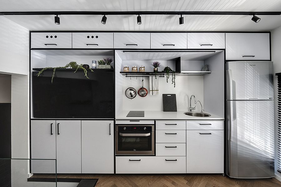 Gorgeous contemporary kitchen with white Formica finish and a black stripe