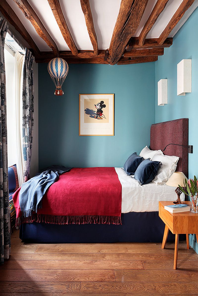 Beautiful use of color in the small eclectic London bedroom
