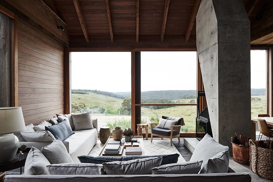 Concrete fireplace structure in the living room makes a big visual impact