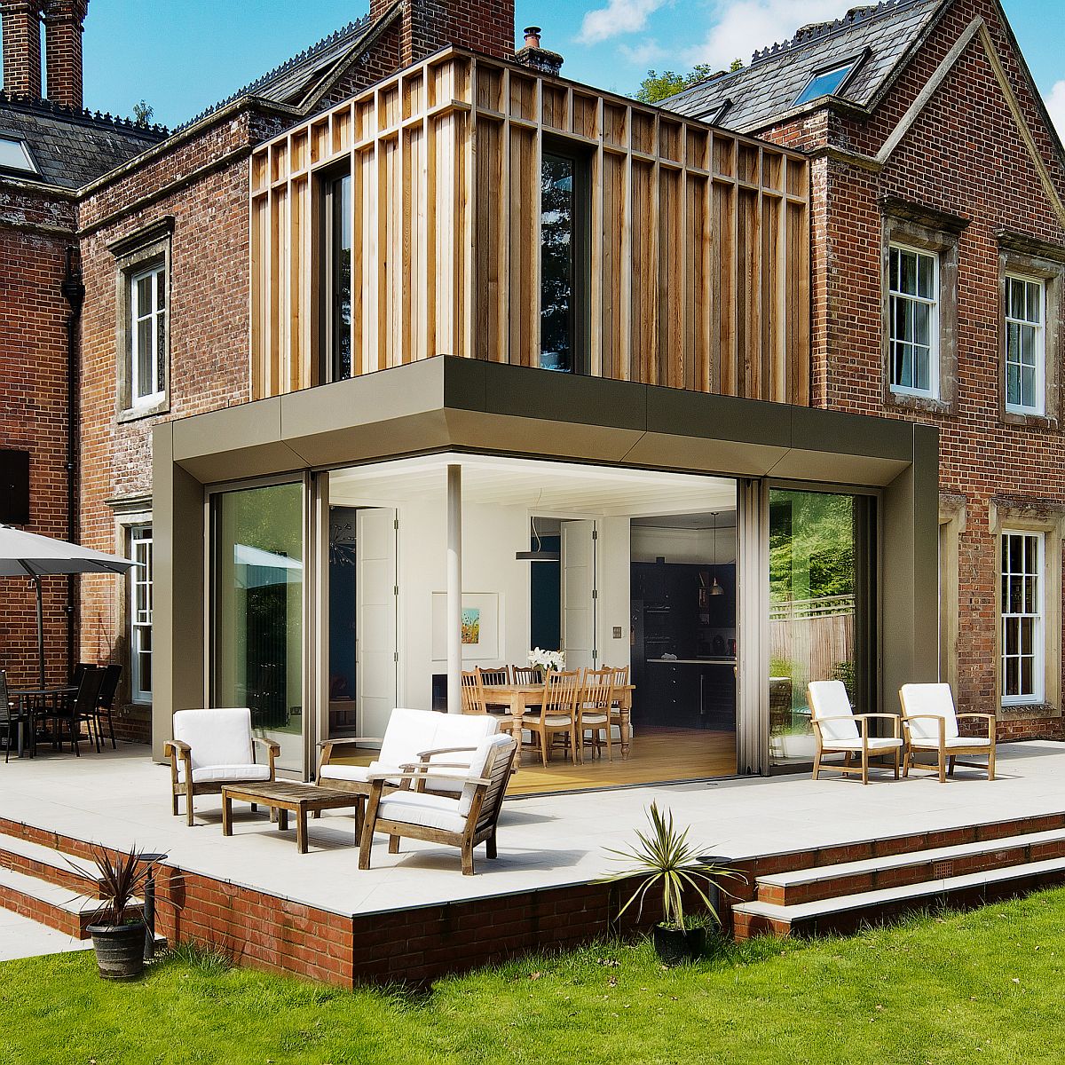 Delightful contemporary extension to historical family house with brick exterior