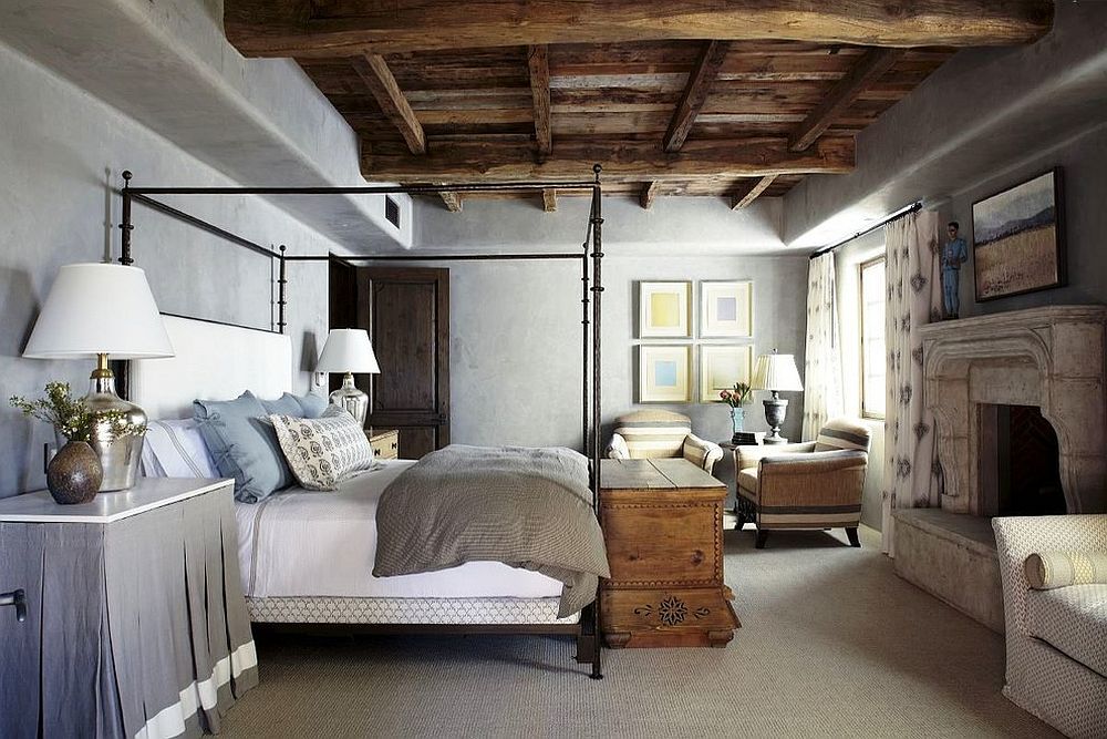 Fabulous Mediterranean bedroom with wooden ceiling, concrete walls and four poster bed