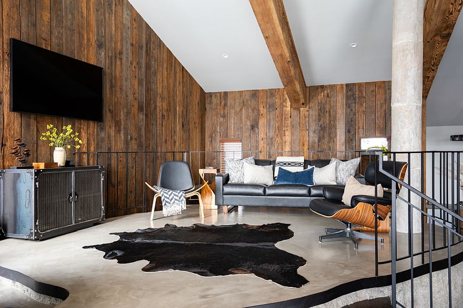 Innovative living room of the house with wooden walls and ceiling beams