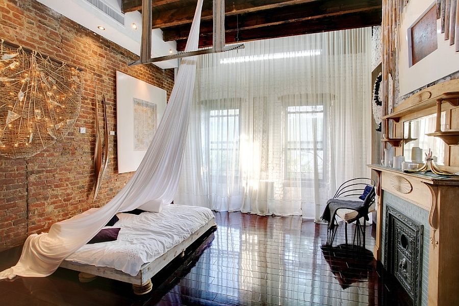 Lovely sheer curtains coupled with the design of the bed give the bedroom a relaxing appeal