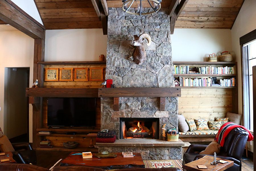 Lovely stone fireplace is a staple in the rustic living room that never fails to impress