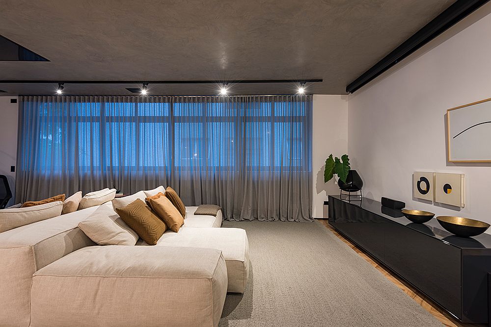 Minimal and stylish bedroom with concrete ceiling and neutral color scheme