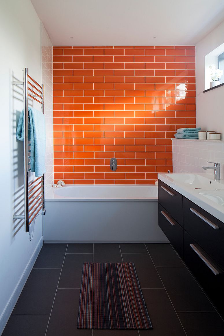 Orange tiled accent wall for the narrow modern bathroom