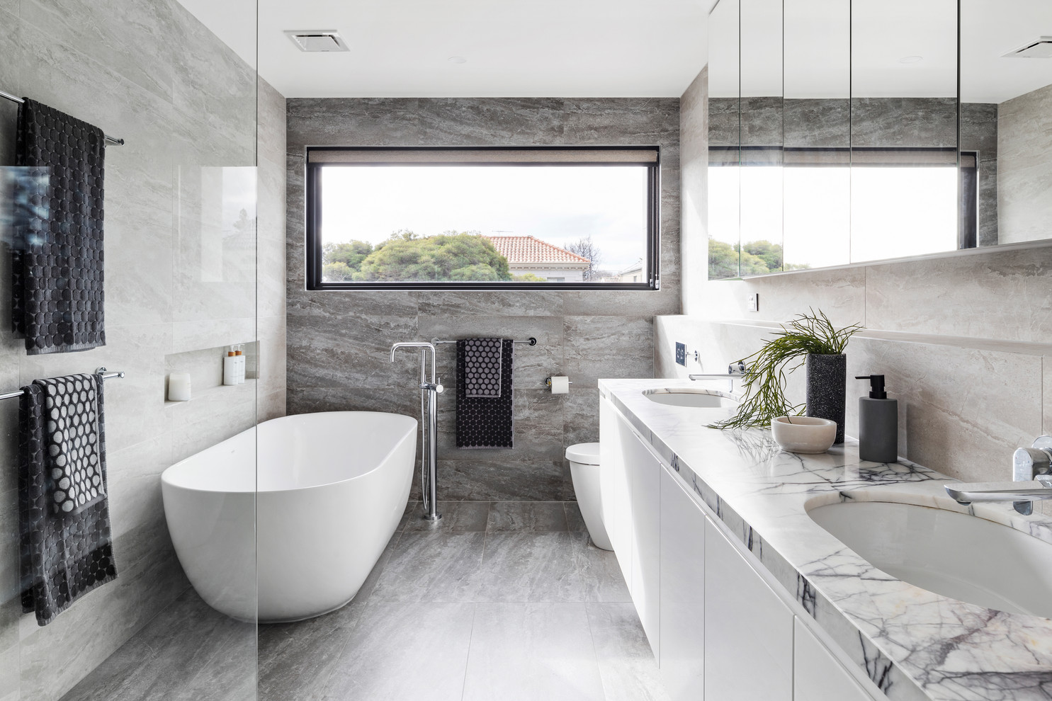 White and stone bathroom looks just splendid!