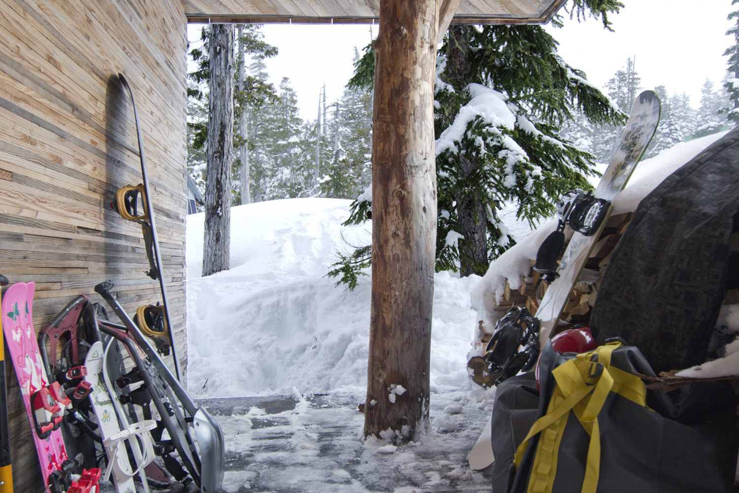Snow that is perfect for skiing shapes teh landscape around the cabin