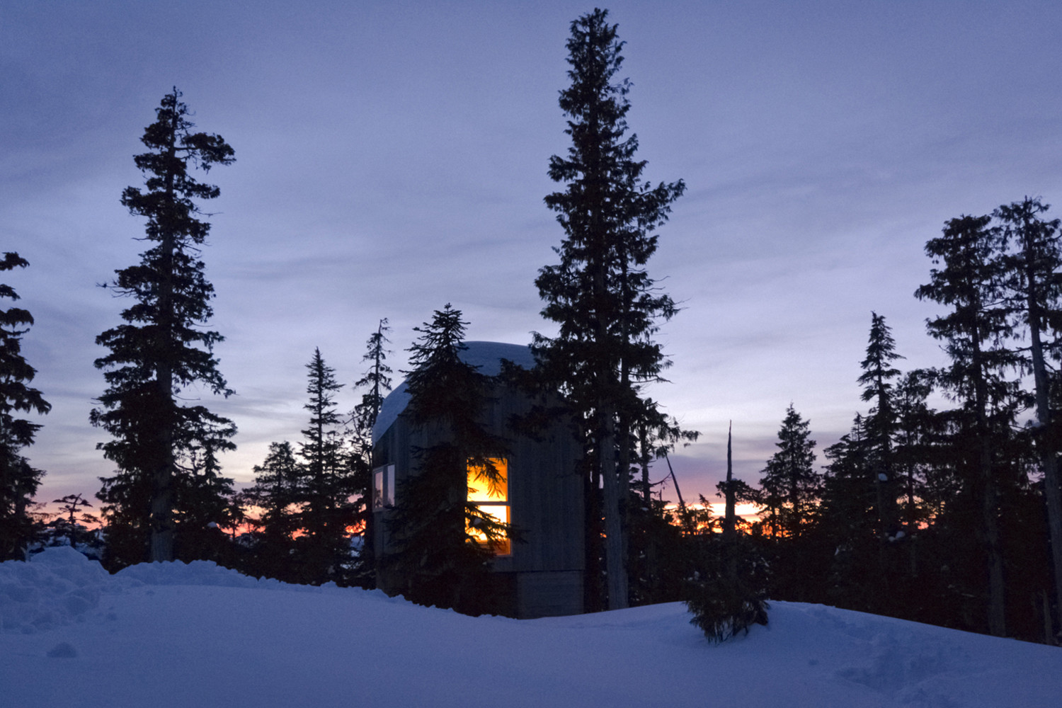 View of the Alpine Cabin after sunset