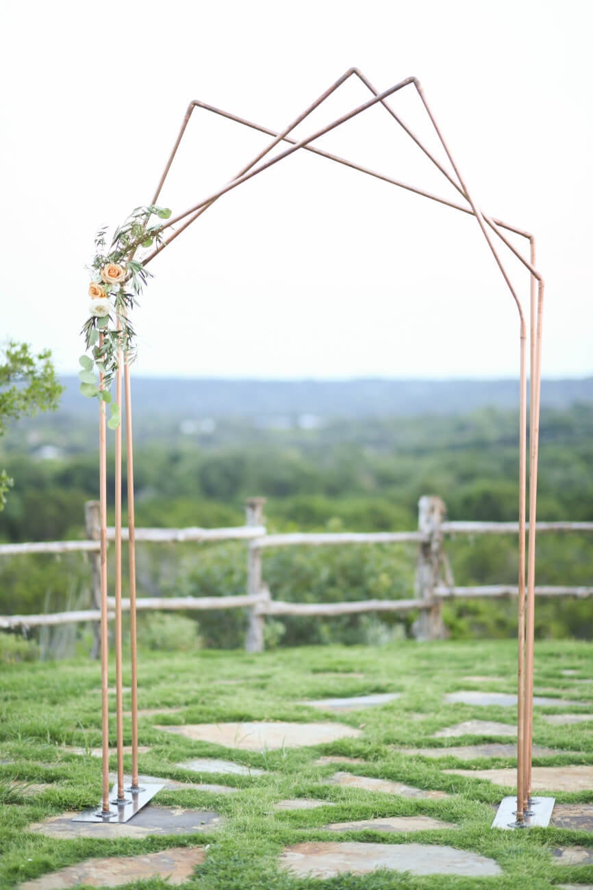 Copper and wood triple peak wedding arch
