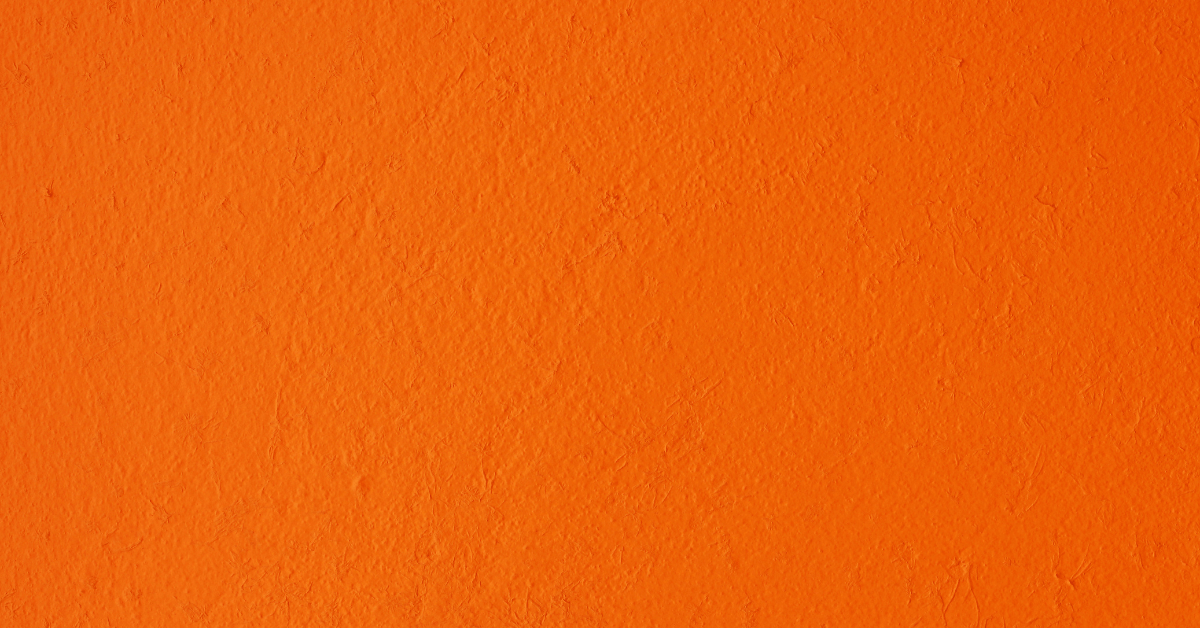 Orange wall with orange peel texture.